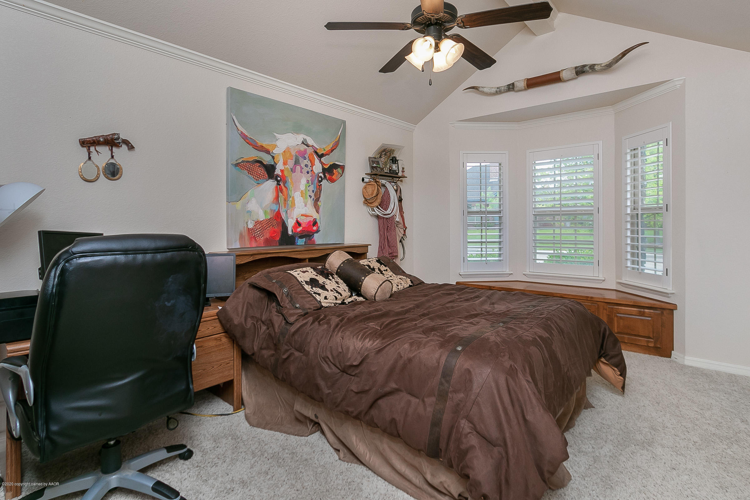 7411 Countryside Drive Amarillo, TX 79119 - Photo 21 of 39 a bed room with a bed and a painting