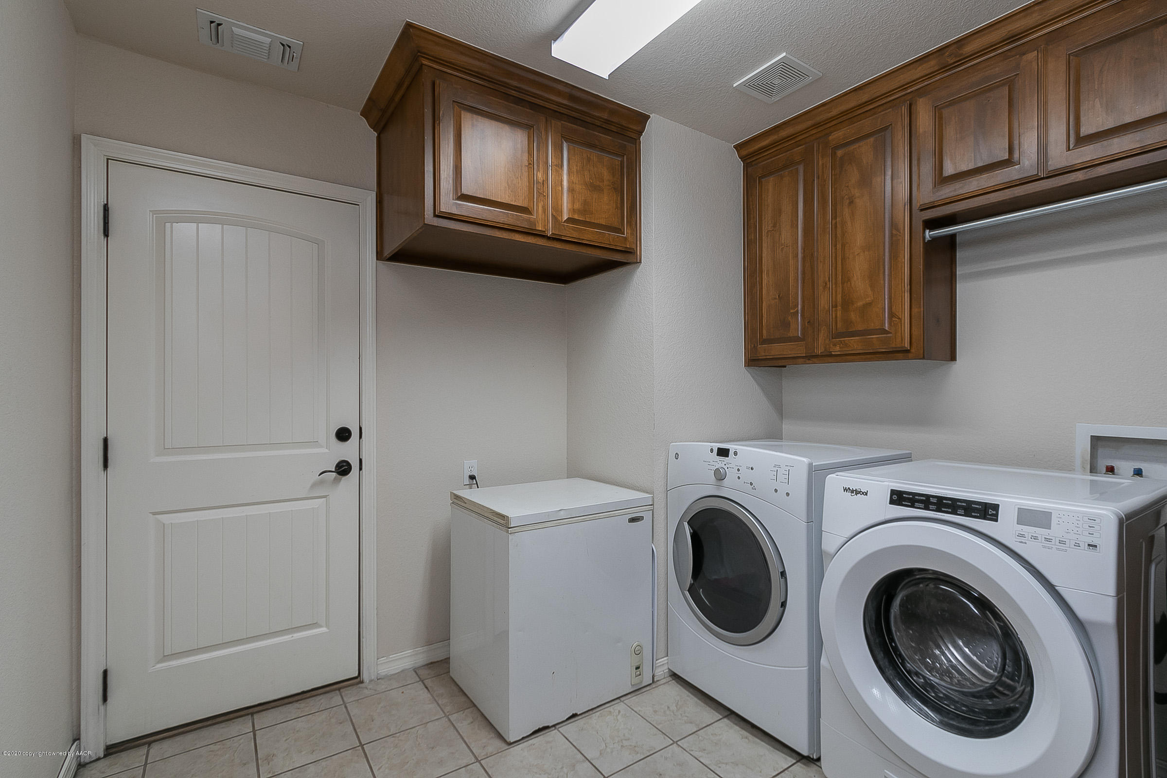 7411 Countryside Drive Amarillo, TX 79119 - Photo 26 of 39 a view of a storage and utility room with washer and dryer