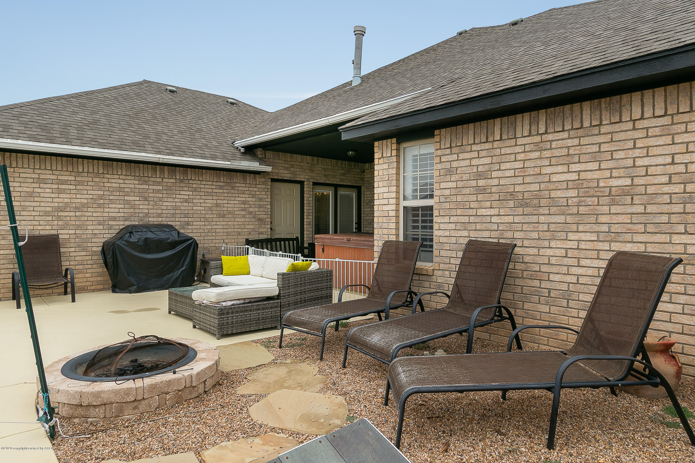 7411 Countryside Drive Amarillo, TX 79119 - Photo 28 of 39 a backyard of a house with seating space
