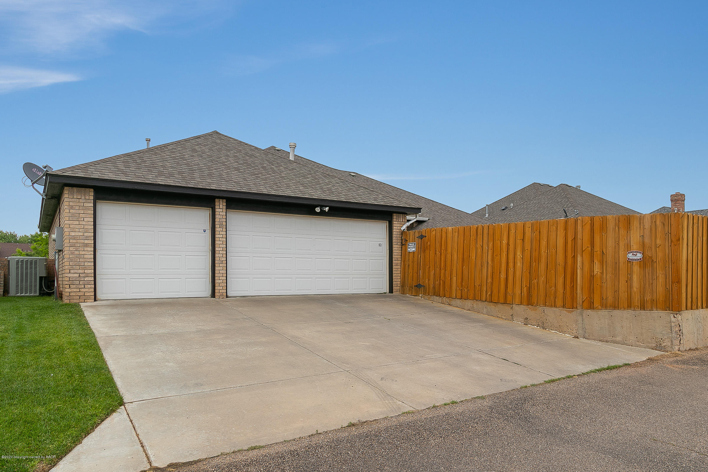 7411 Countryside Drive Amarillo, TX 79119 - Photo 32 of 39 a front view of a house with a yard