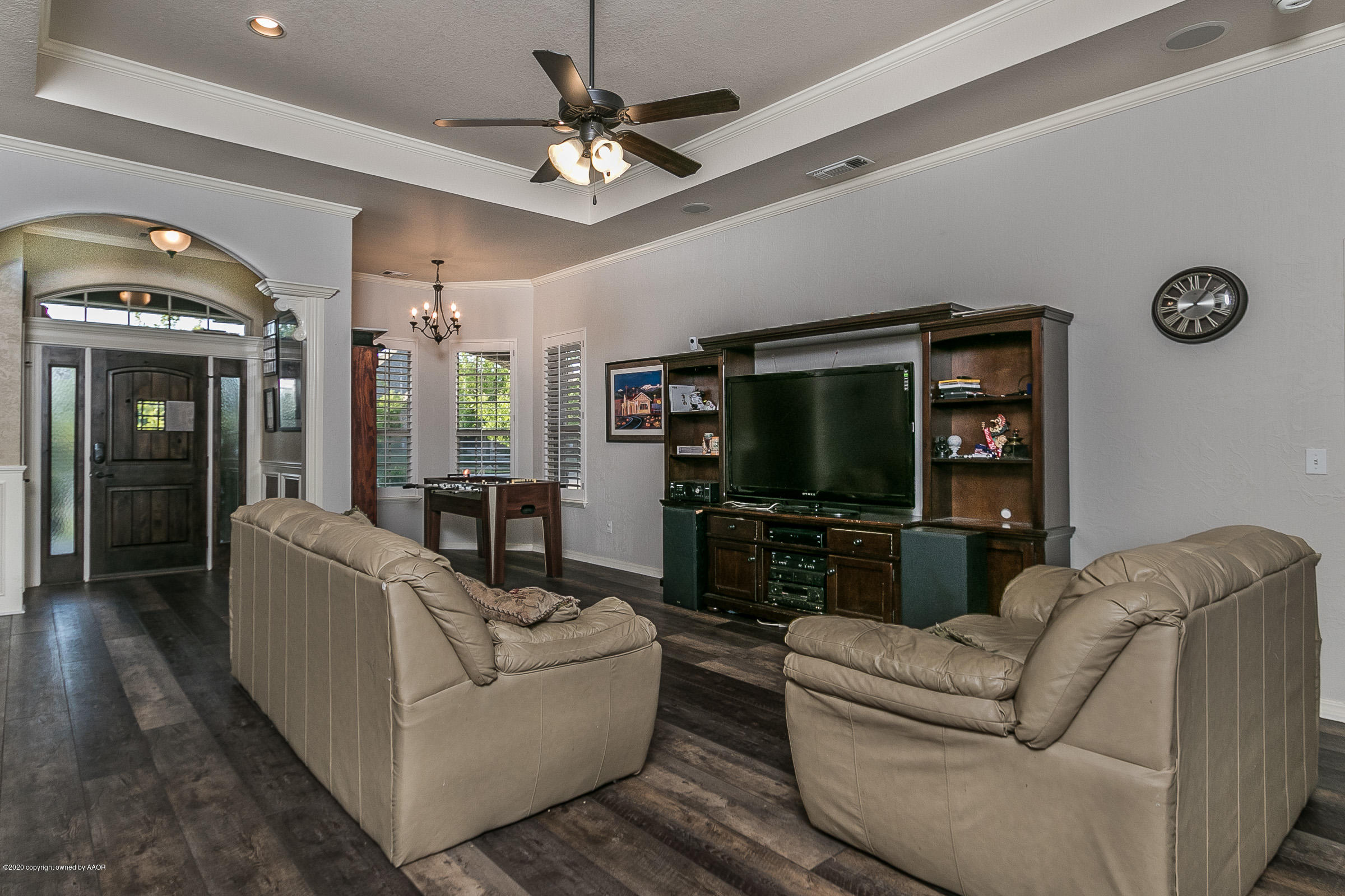 7411 Countryside Drive Amarillo, TX 79119 - Photo 35 of 39 a living room with furniture and a flat screen tv