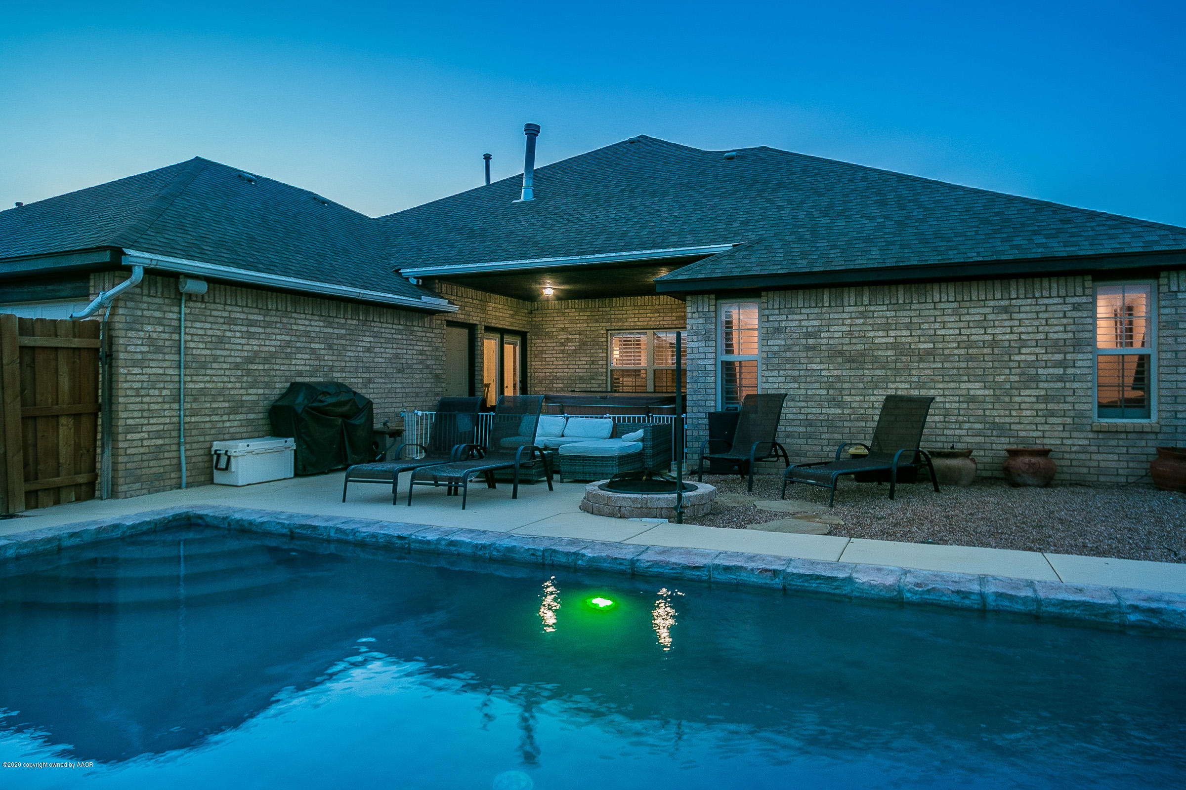 7411 Countryside Drive Amarillo, TX 79119 - Photo 36 of 39 a front view of house with yard and outdoor seating