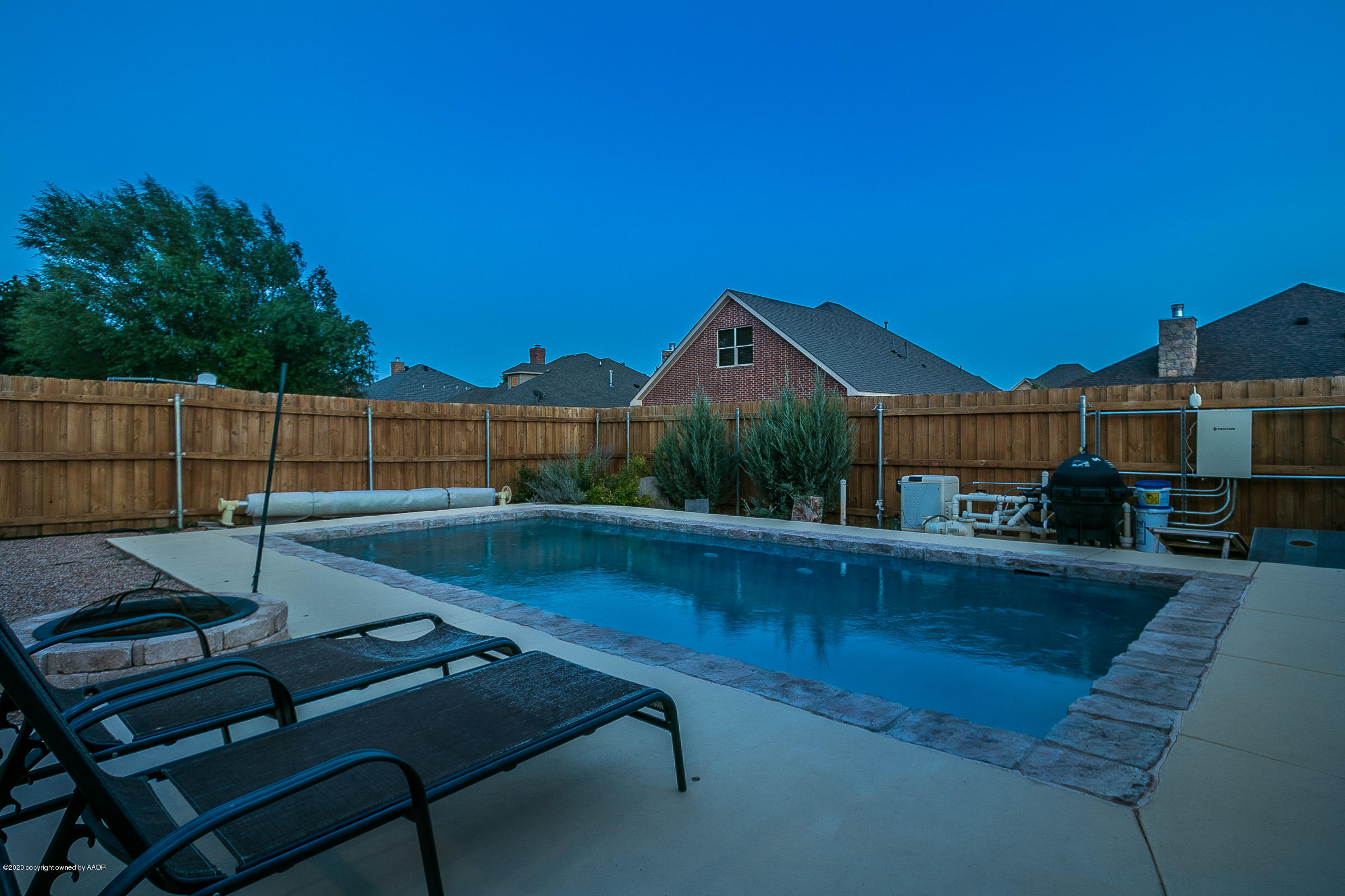 7411 Countryside Drive Amarillo, TX 79119 - Photo 37 of 39 a view of a patio with table and chairs with wooden floor and fence