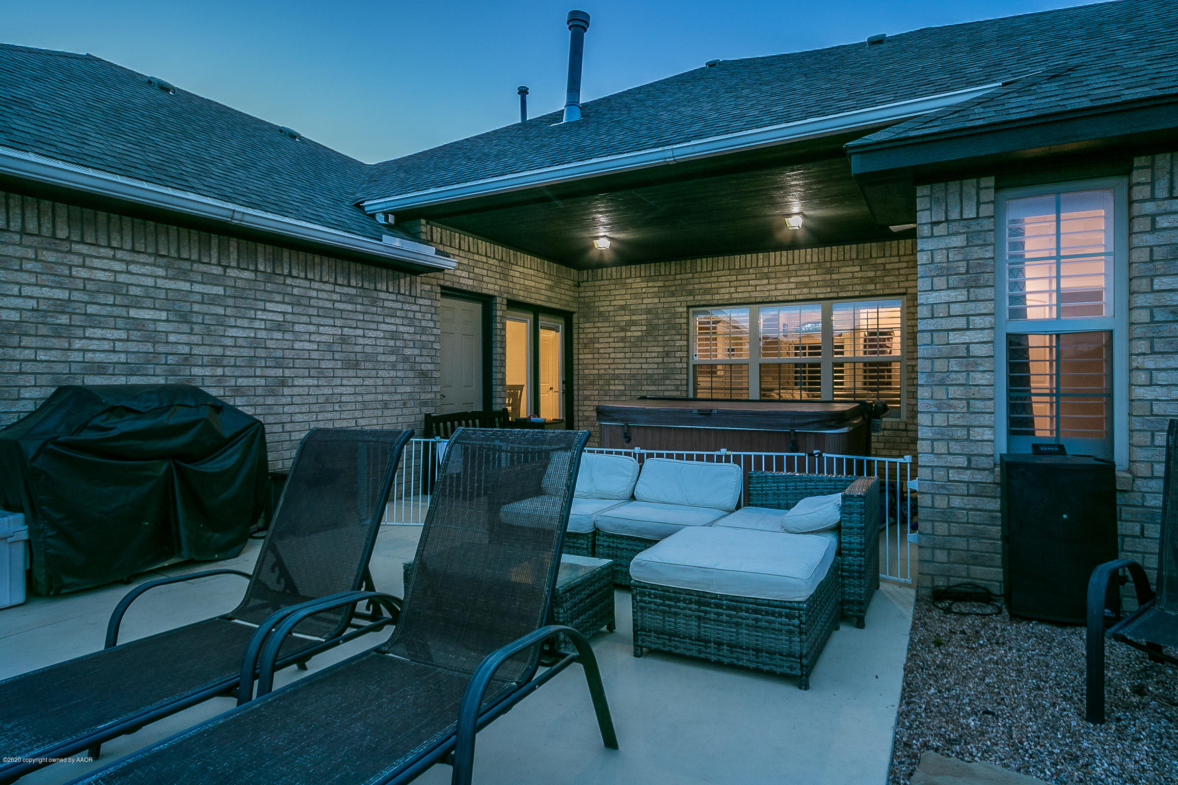 7411 Countryside Drive Amarillo, TX 79119 - Photo 39 of 39 a living room with furniture and a flat screen tv