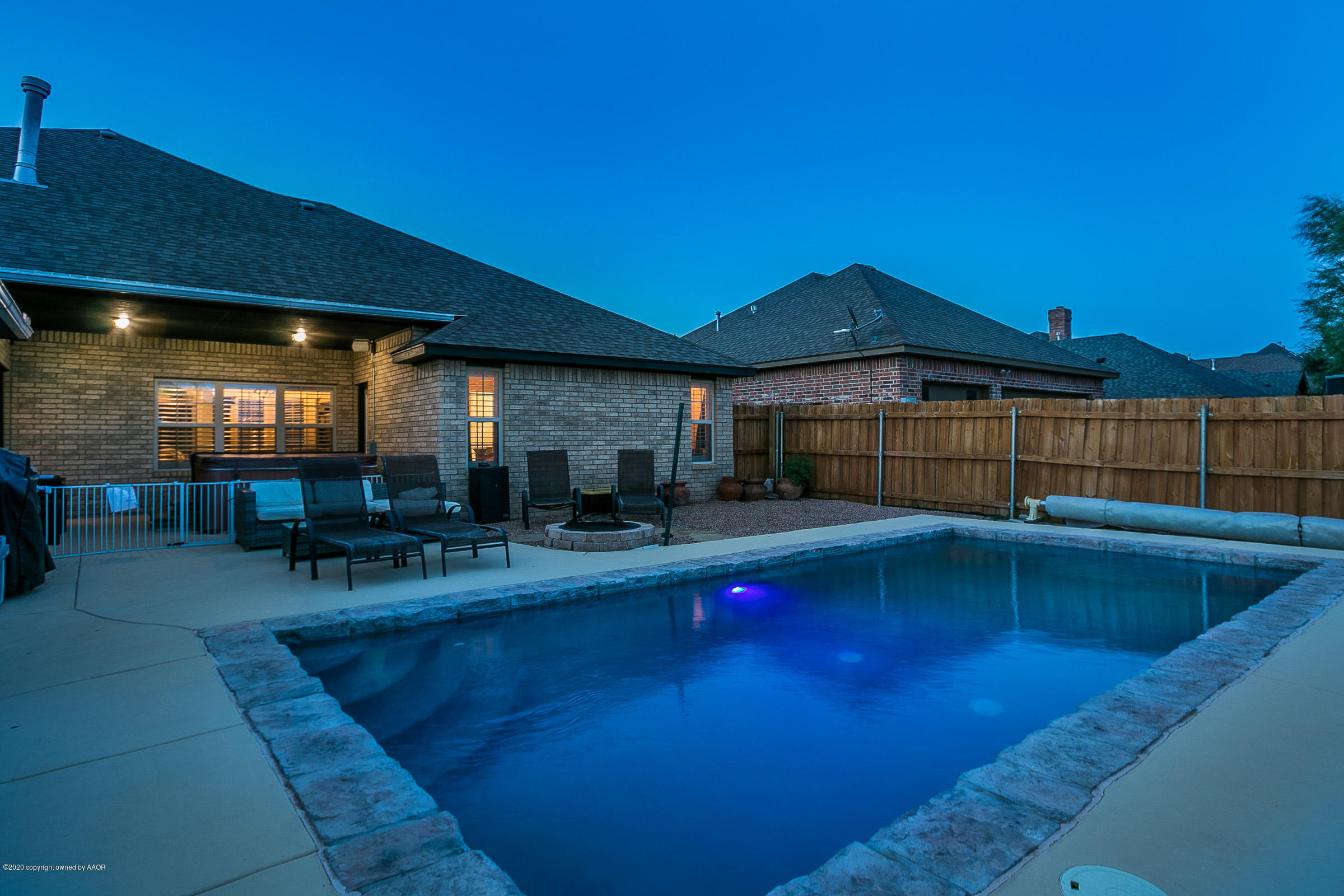 7411 Countryside Drive Amarillo, TX 79119 - Photo 6 of 39 a view of backyard with swimming pool and outdoor seating