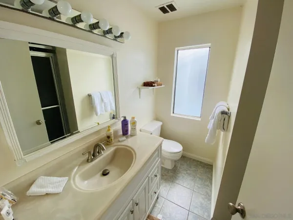 a bathroom with a shower and a sink