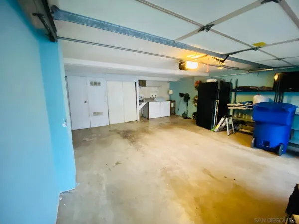 a view of a livingroom with furniture and stairs