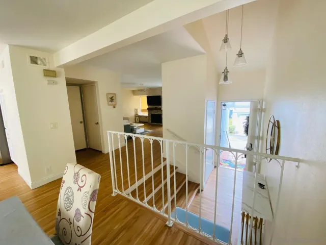 a kitchen with a sink a refrigerator and a stove top oven