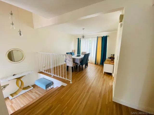 a kitchen with stainless steel appliances a stove a sink a refrigerator a microwave and cabinets