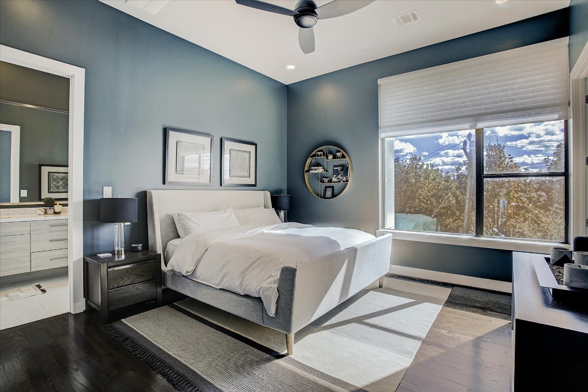 1004 California Street, Unit 101 Houston, TX 77006 - Photo 18 of 27 a spacious bedroom with a bed and a large window