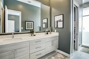 1004 California Street, Unit 101 Houston, TX 77006 - Photo 20 of 27 a bathroom with 2 sink and a mirror
