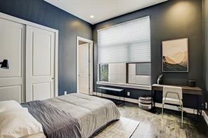 1004 California Street, Unit 101 Houston, TX 77006 - Photo 24 of 27 a bedroom with a bed and a dresser next to a window