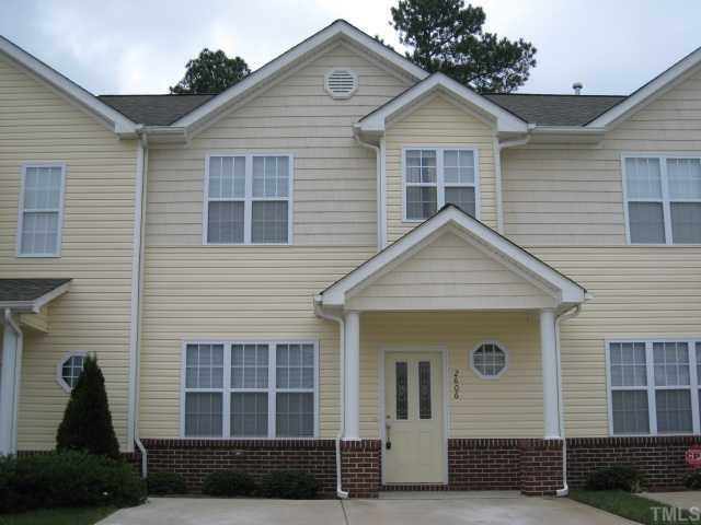 2606 Andover Glen Road Raleigh, NC 27604 - Photo 1 of 5 a view of a house with a yard and large windows