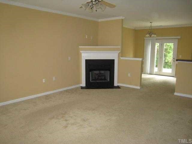 2606 Andover Glen Road Raleigh, NC 27604 - Photo 2 of 5 a view of an empty room with a fireplace