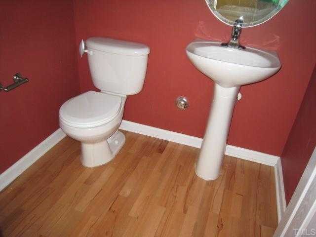 2606 Andover Glen Road Raleigh, NC 27604 - Photo 4 of 5 a bathroom with a sink and a toilet