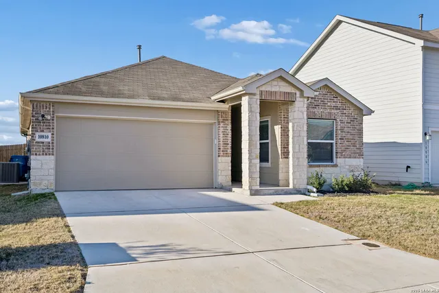 a front view of a house with yard