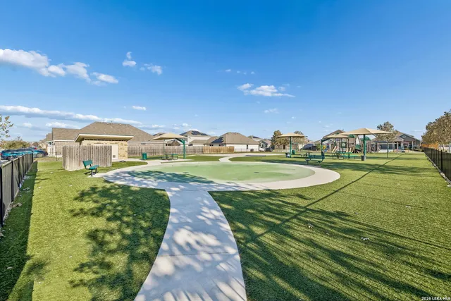 a view of a swimming pool with a yard