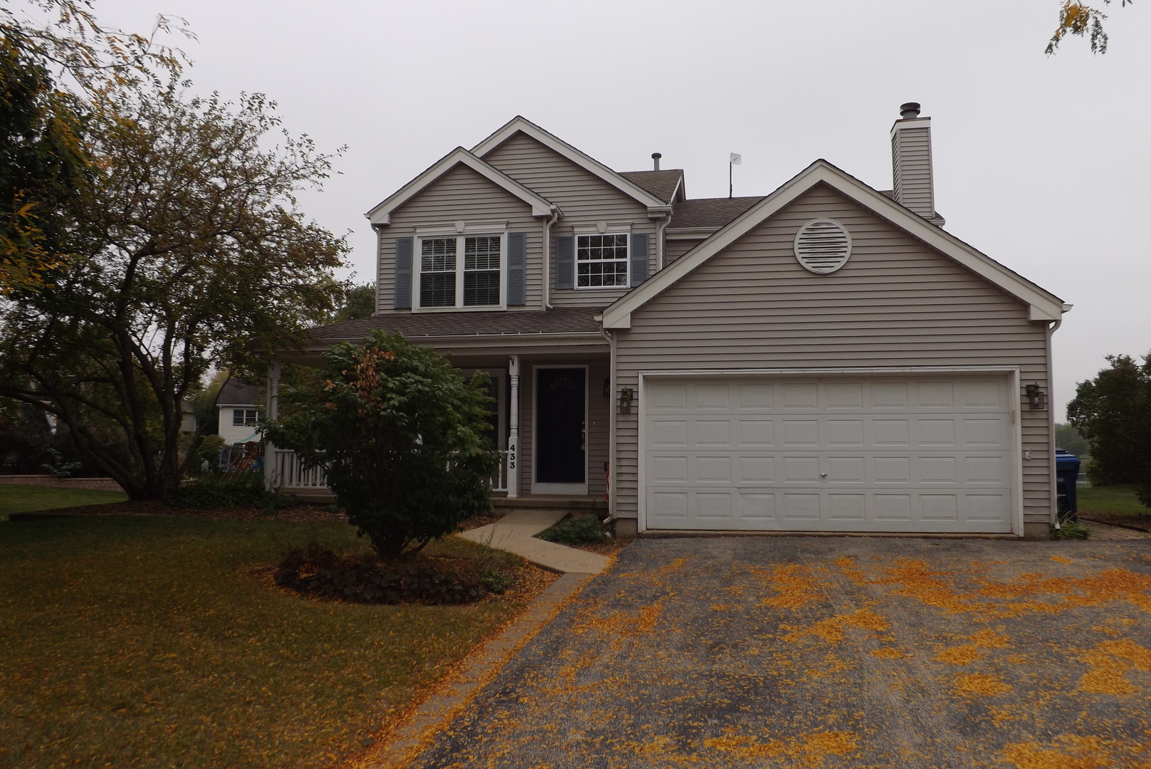 433 Prairie Valley Street Elburn, IL 60119 - Photo 1 of 21 a front view of a house with a garden