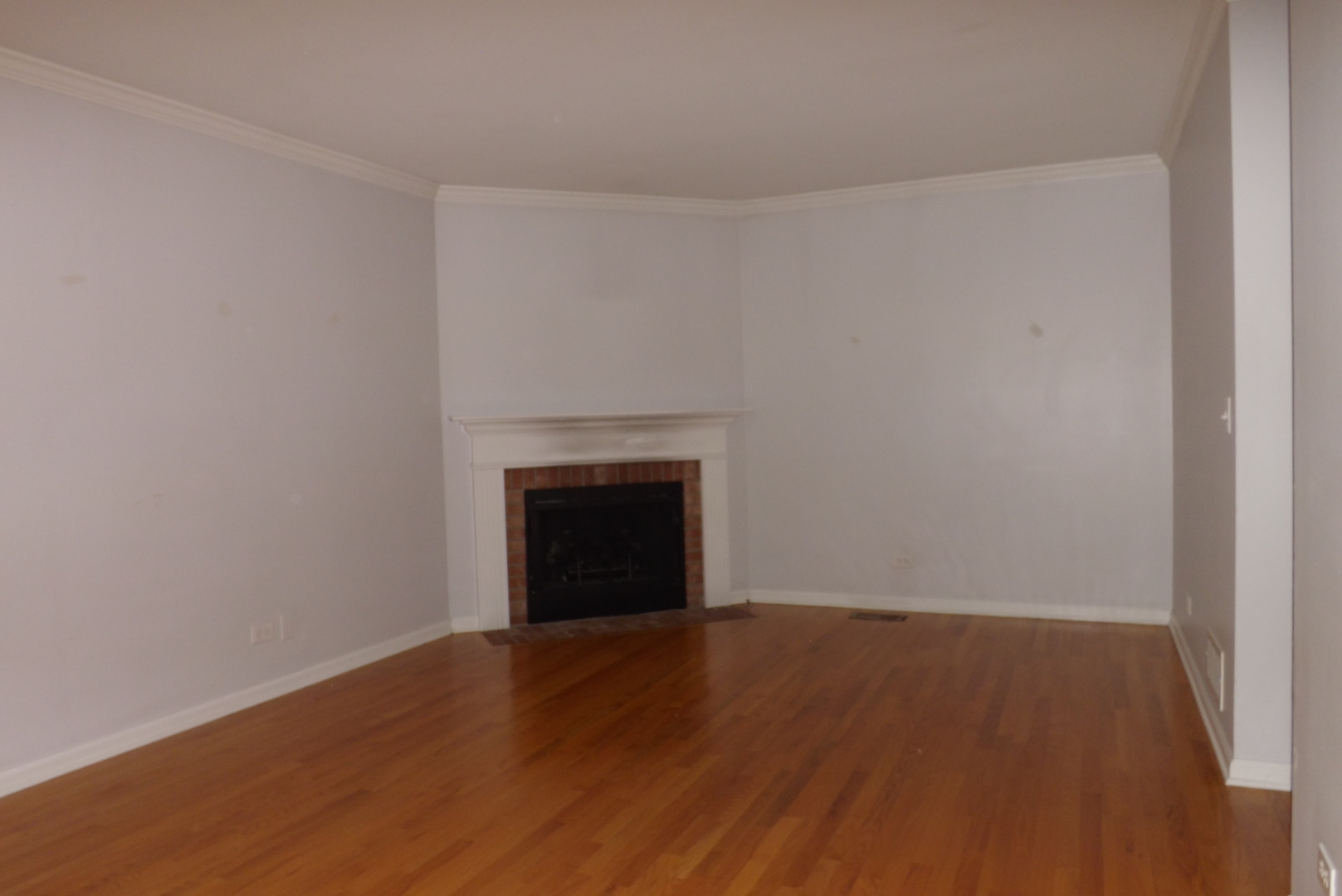 433 Prairie Valley Street Elburn, IL 60119 - Photo 12 of 21 a view of an empty room with wooden floor and a window