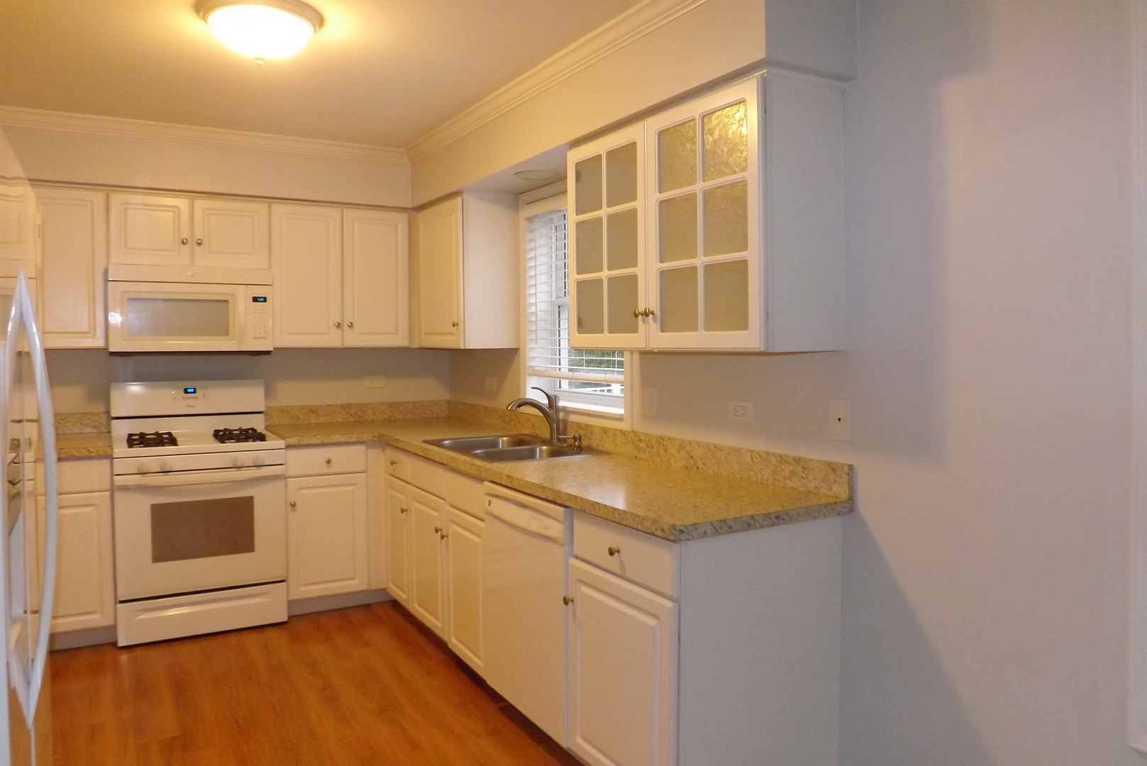 433 Prairie Valley Street Elburn, IL 60119 - Photo 8 of 21 a kitchen with stainless steel appliances granite countertop a sink stove and cabinets