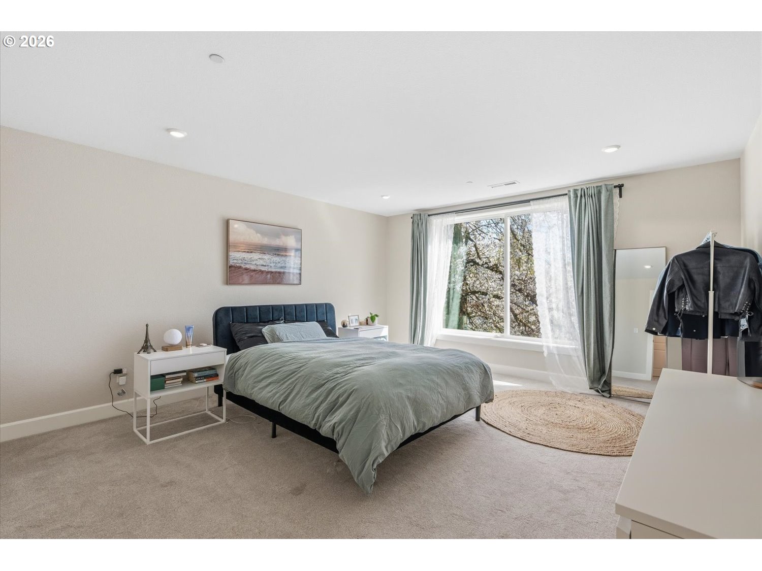 2059 Southeast 176th Avenue Portland, OR 97233 - Photo 13 of 31 a living room with a bed furniture and a large window