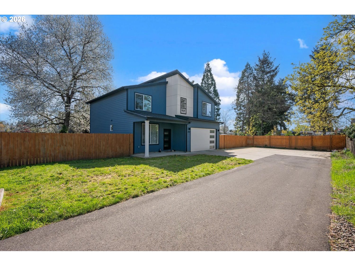 2059 Southeast 176th Avenue Portland, OR 97233 - Photo 31 of 31 a front view of a house with a yard and garage
