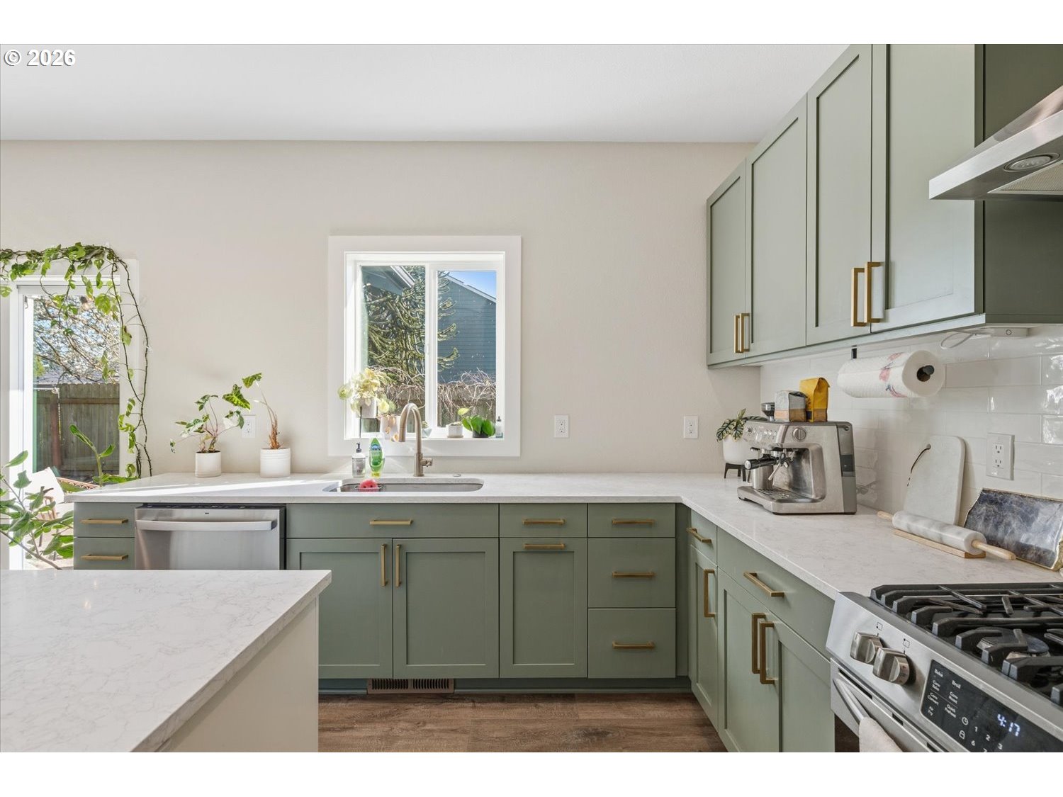 2059 Southeast 176th Avenue Portland, OR 97233 - Photo 5 of 31 a kitchen with stainless steel appliances a sink stove and cabinets