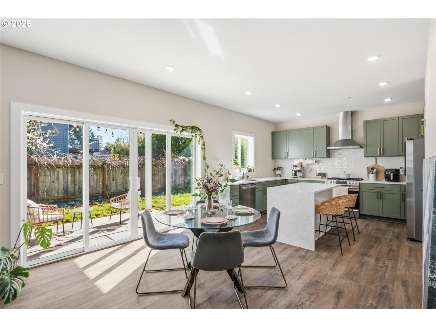 2059 Southeast 176th Avenue Portland, OR 97233 - Photo 7 of 31 a dining room with furniture and large windows