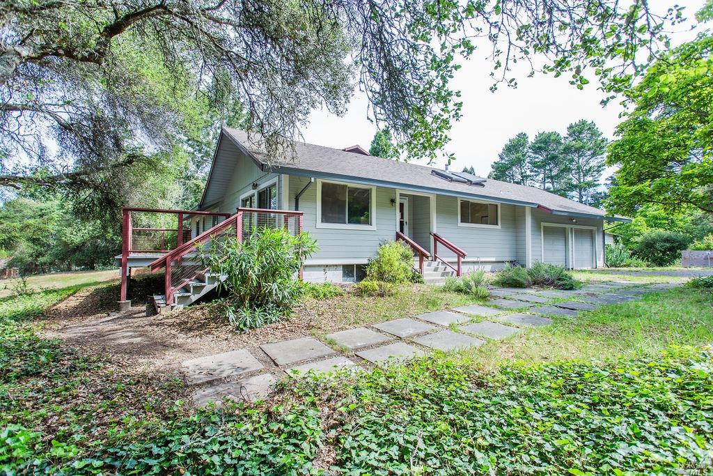 front view of a house with a yard