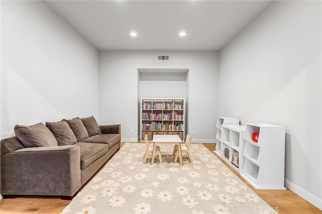 2269 Shady Oaks Road Glendora, CA 91741 - Photo 13 of 62 a living room with furniture and a book shelf