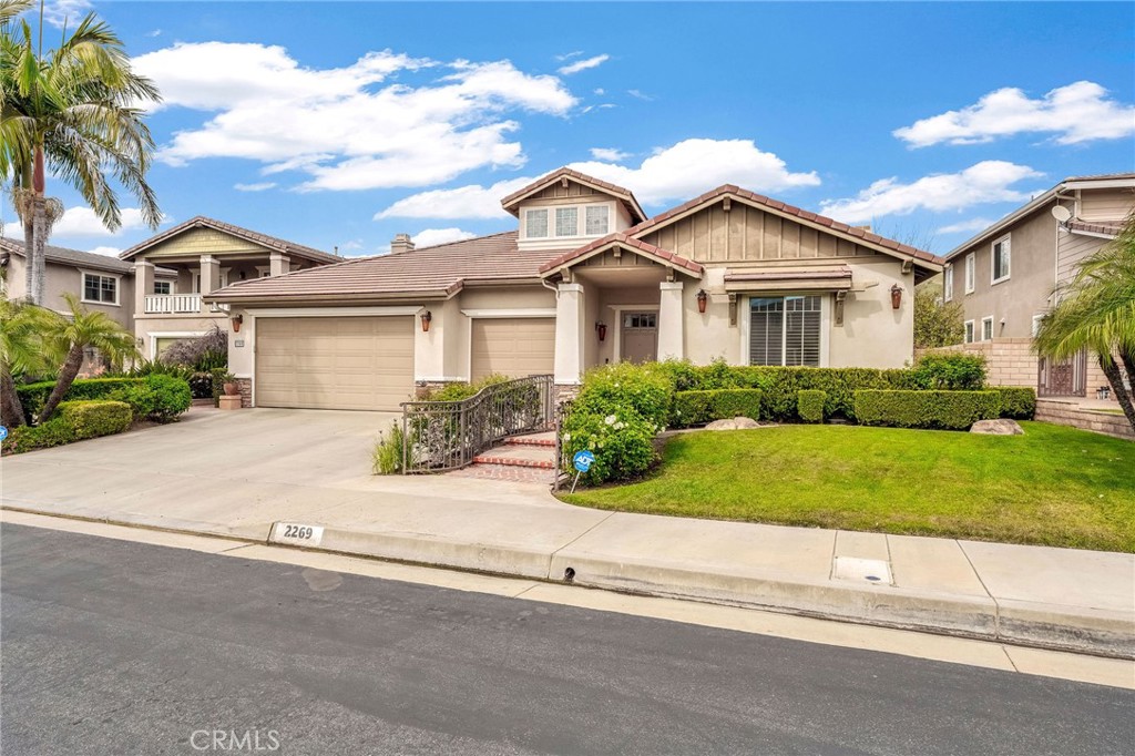 2269 Shady Oaks Road Glendora, CA 91741 - Photo 3 of 62 a front view of a house with a garden and trees