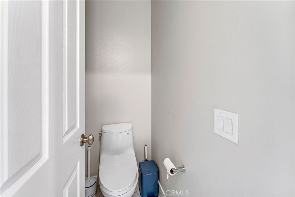 2269 Shady Oaks Road Glendora, CA 91741 - Photo 41 of 62 a white toilet sitting next to a shower curtain