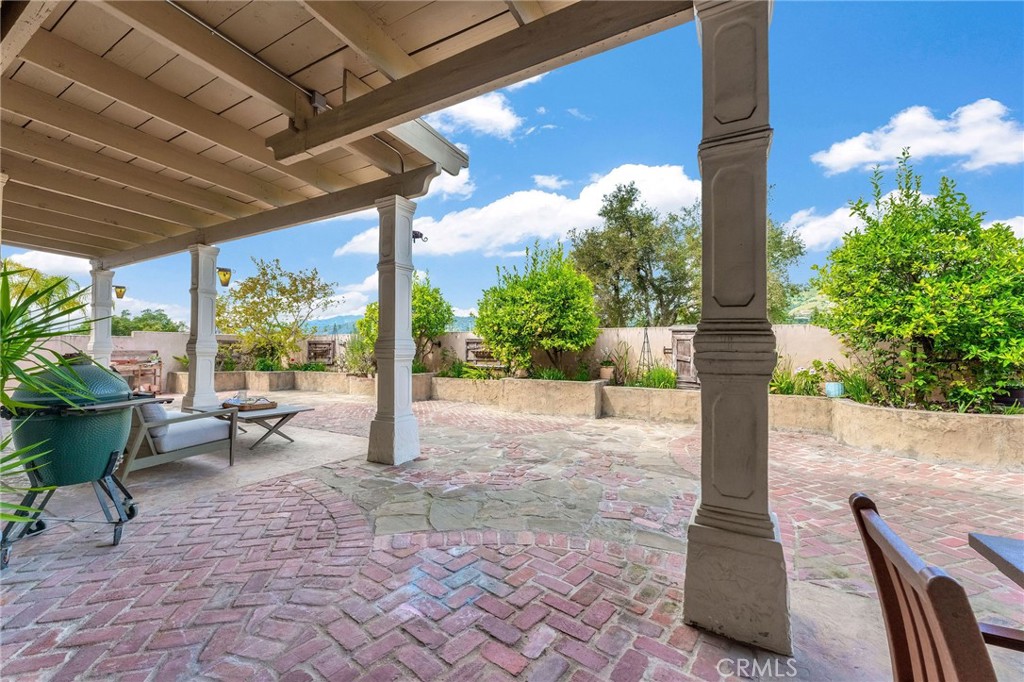 2269 Shady Oaks Road Glendora, CA 91741 - Photo 47 of 62 a view of a patio with table and chairs potted plants with wooden floor