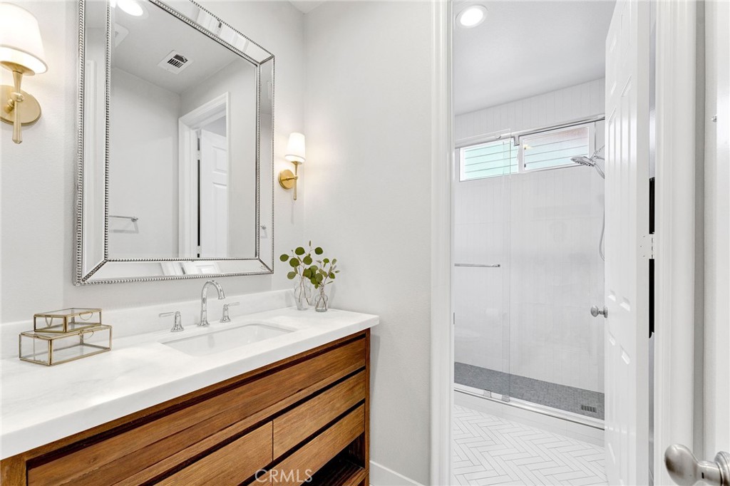 2269 Shady Oaks Road Glendora, CA 91741 - Photo 7 of 62 a bathroom with a granite countertop sink and a mirror