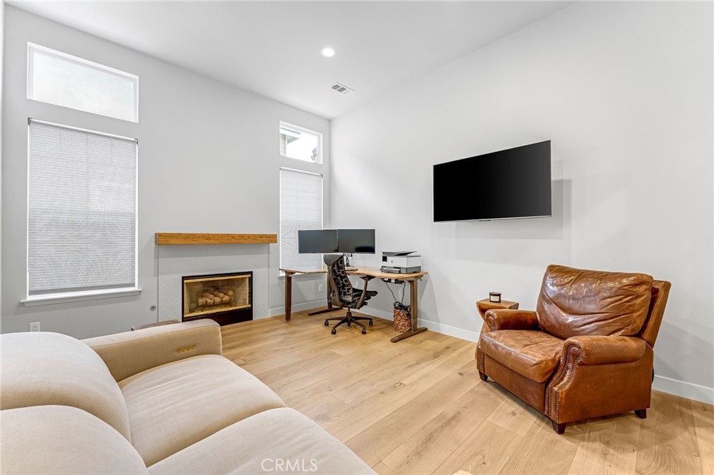 2269 Shady Oaks Road Glendora, CA 91741 - Photo 10 of 62 a living room with furniture a fireplace and a flat screen tv
