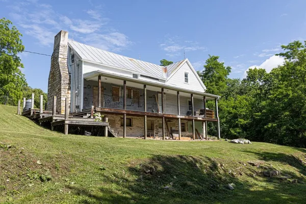a view of a backyard of the house