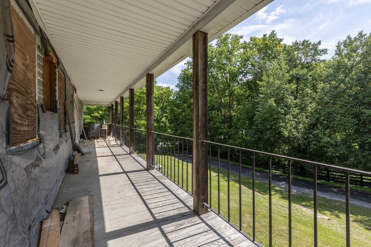 13573 Cooley Spring Lane Broadway, VA 22815 - Photo 27 of 63 a view of balcony with wooden floor and fence