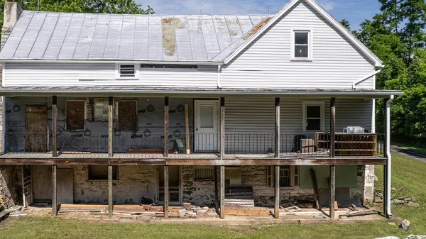 a view of a city with lush green forest