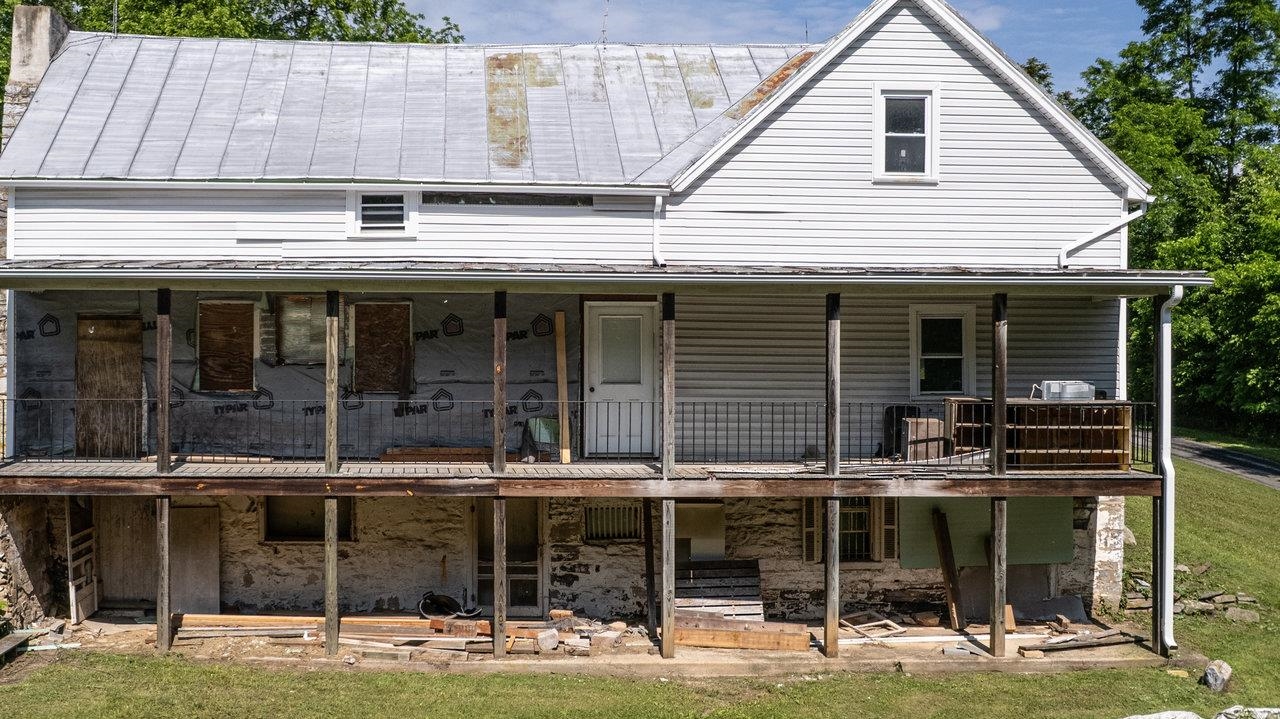13573 Cooley Spring Lane Broadway, VA 22815 - Photo 30 of 63 a view of a cafe with sitting area and floor to ceiling window