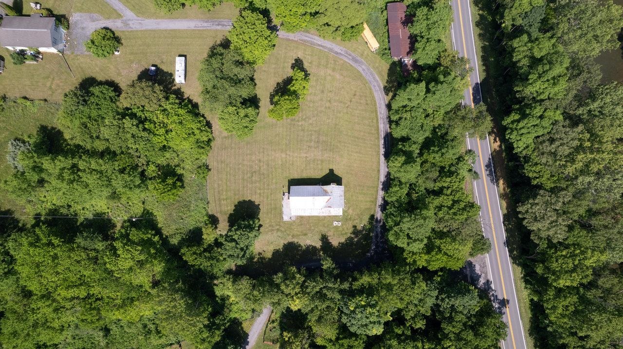 13573 Cooley Spring Lane Broadway, VA 22815 - Photo 34 of 63 an aerial view of a house with a yard and garden