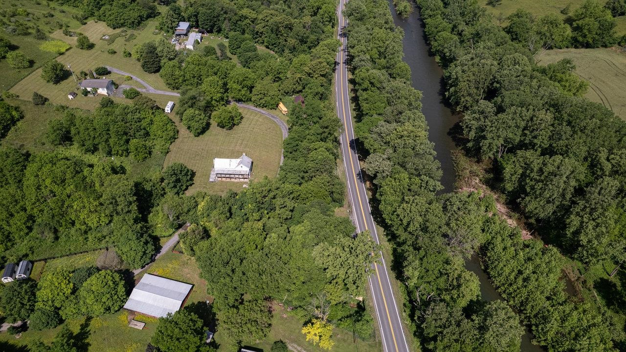 13573 Cooley Spring Lane Broadway, VA 22815 - Photo 45 of 63 an aerial view of residential house with outdoor space and trees all around