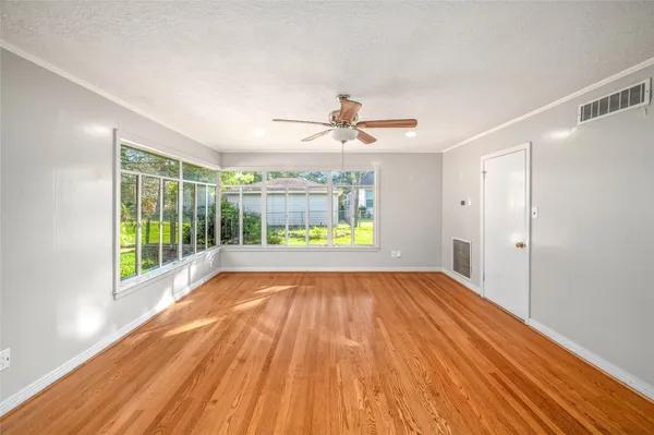 a view of an empty room with a window