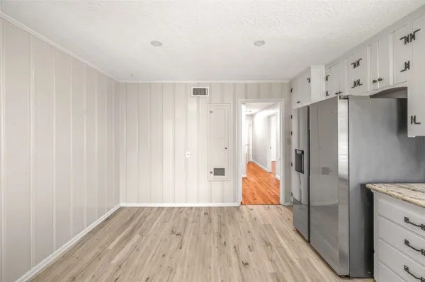 a view of kitchen with wooden floor and window