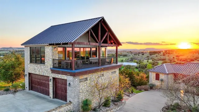 a view of a house with pool and chairs