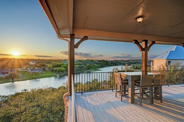 a view of a balcony with lake view and mountain view
