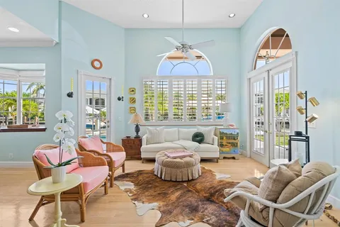 a bathroom with a shower sink vanity mirror and toilet