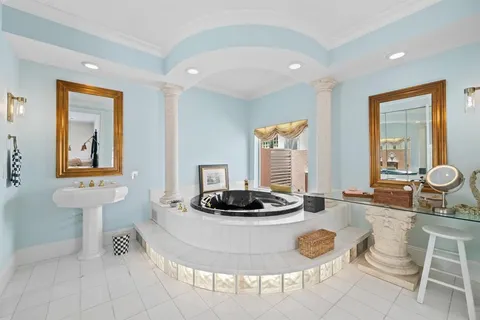 a view of a patio with couches and swimming pool