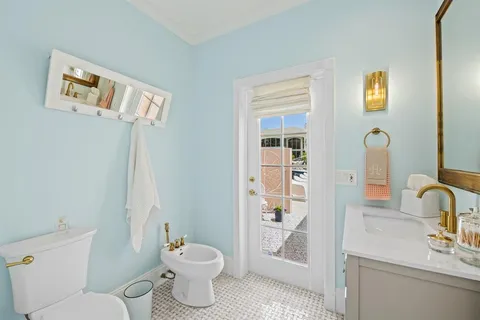 a front view of house with yard and green space