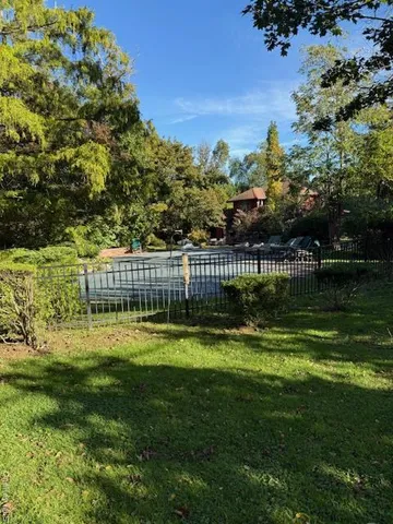 a view of a garden with swimming pool