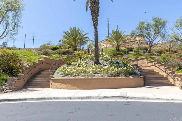 a view of a patio with table and chairs and potted plants